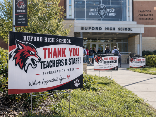 Graduation yard signs displayed for a school celebration