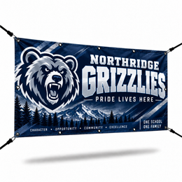 Navy vinyl banner with a bear mascot, grommets, and bungee cords on a white background